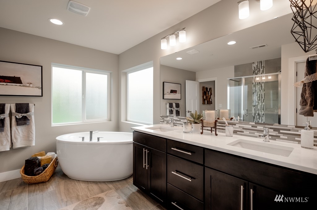 620 215th Street Southeast, Unit RM6 Bothell, WA 98021 - Photo 18 of 28 a bathroom with a double vanity sink and a bathtub