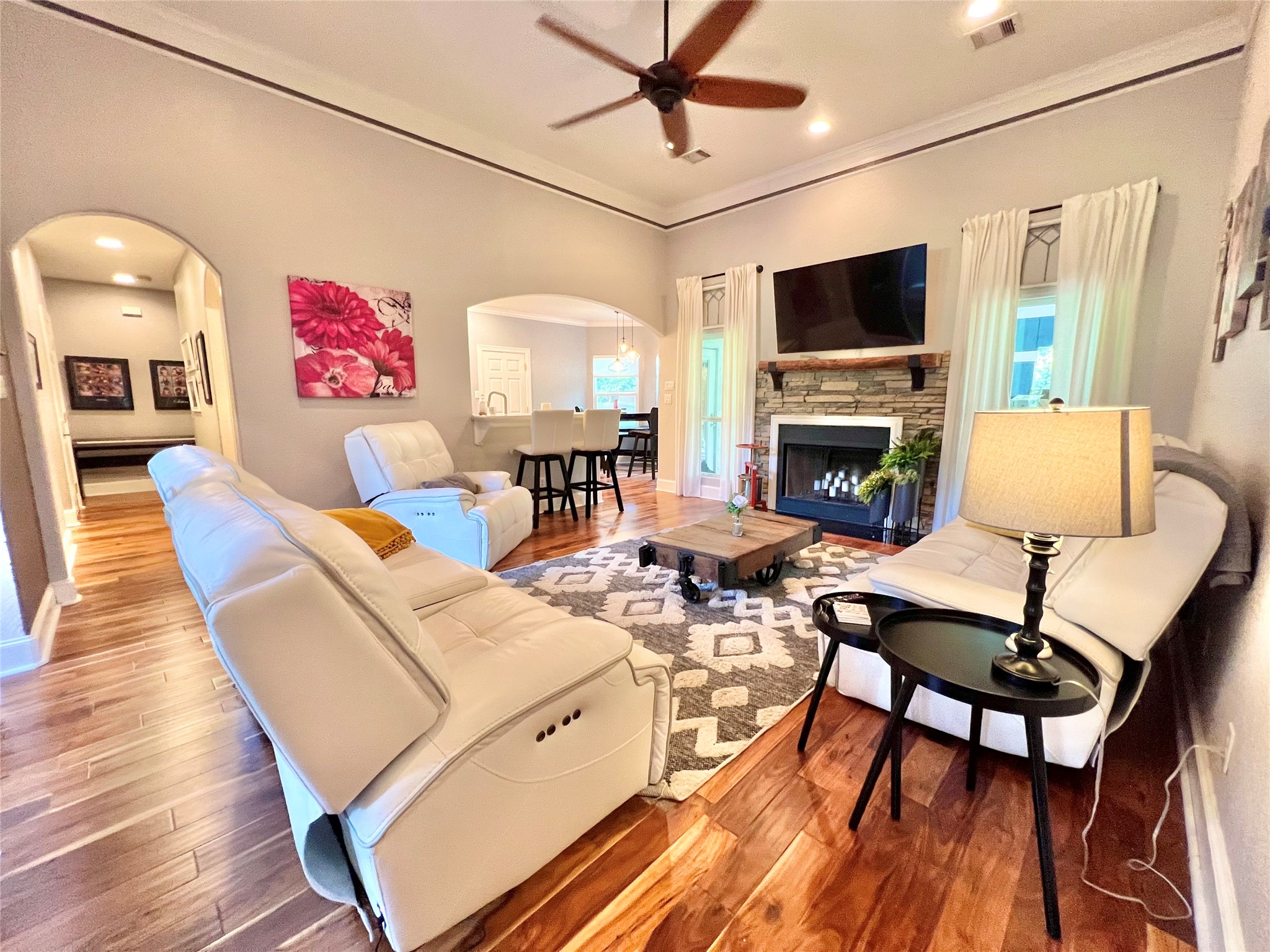6714 Jay Road Hitchcock, TX 77563 - Photo 11 of 50 a living room with furniture a flat screen tv and a fireplace
