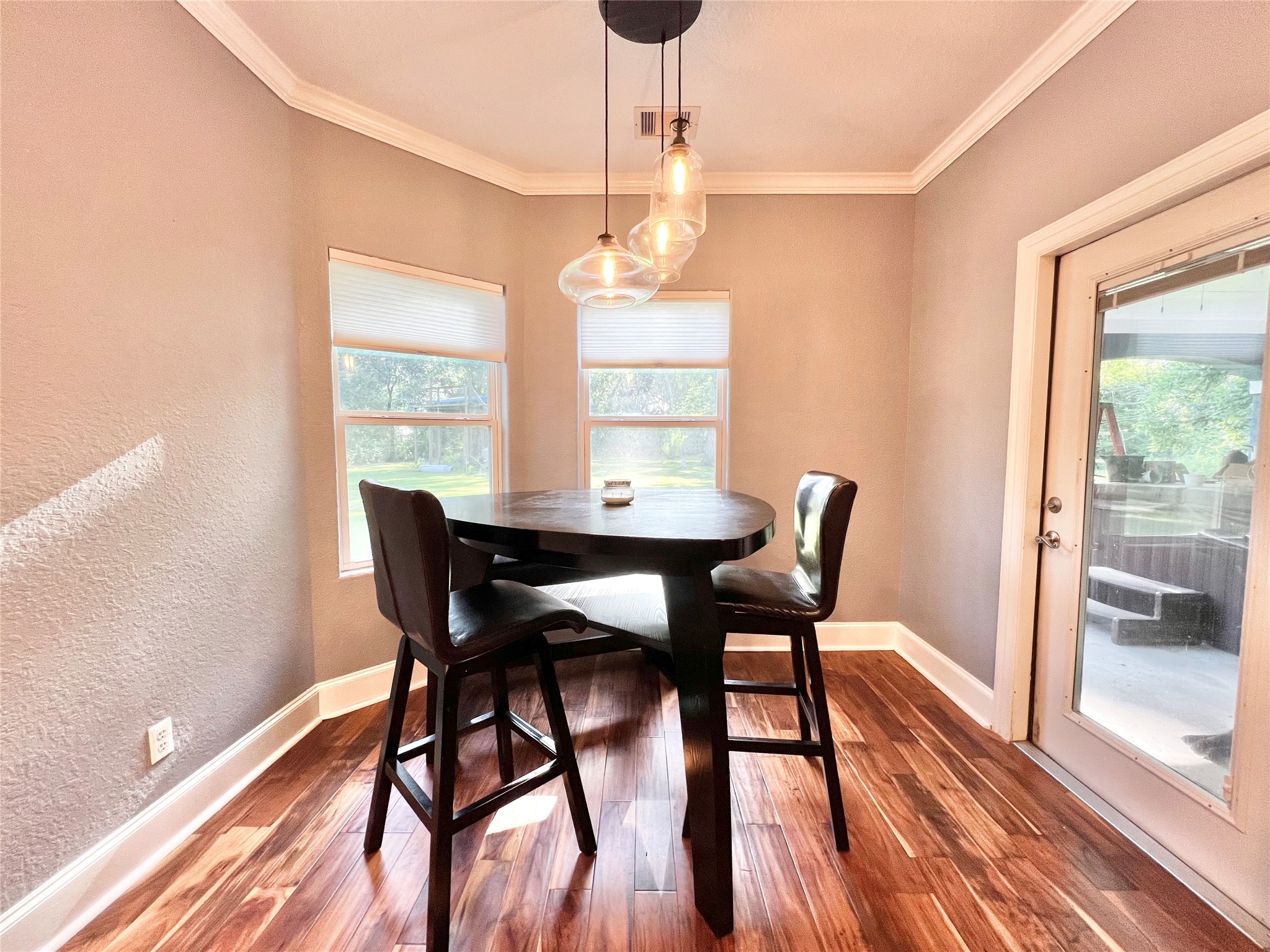 6714 Jay Road Hitchcock, TX 77563 - Photo 16 of 50 a view of a dining room with furniture window and wooden floor