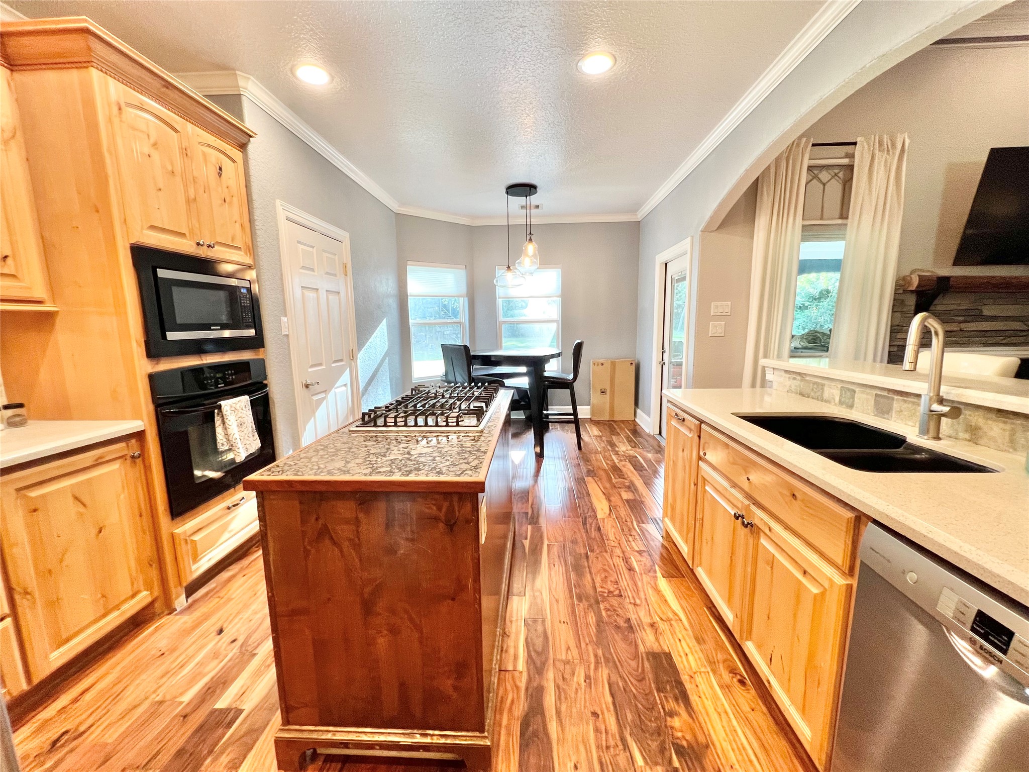 6714 Jay Road Hitchcock, TX 77563 - Photo 17 of 50 a kitchen with stainless steel appliances granite countertop a sink stove and refrigerator