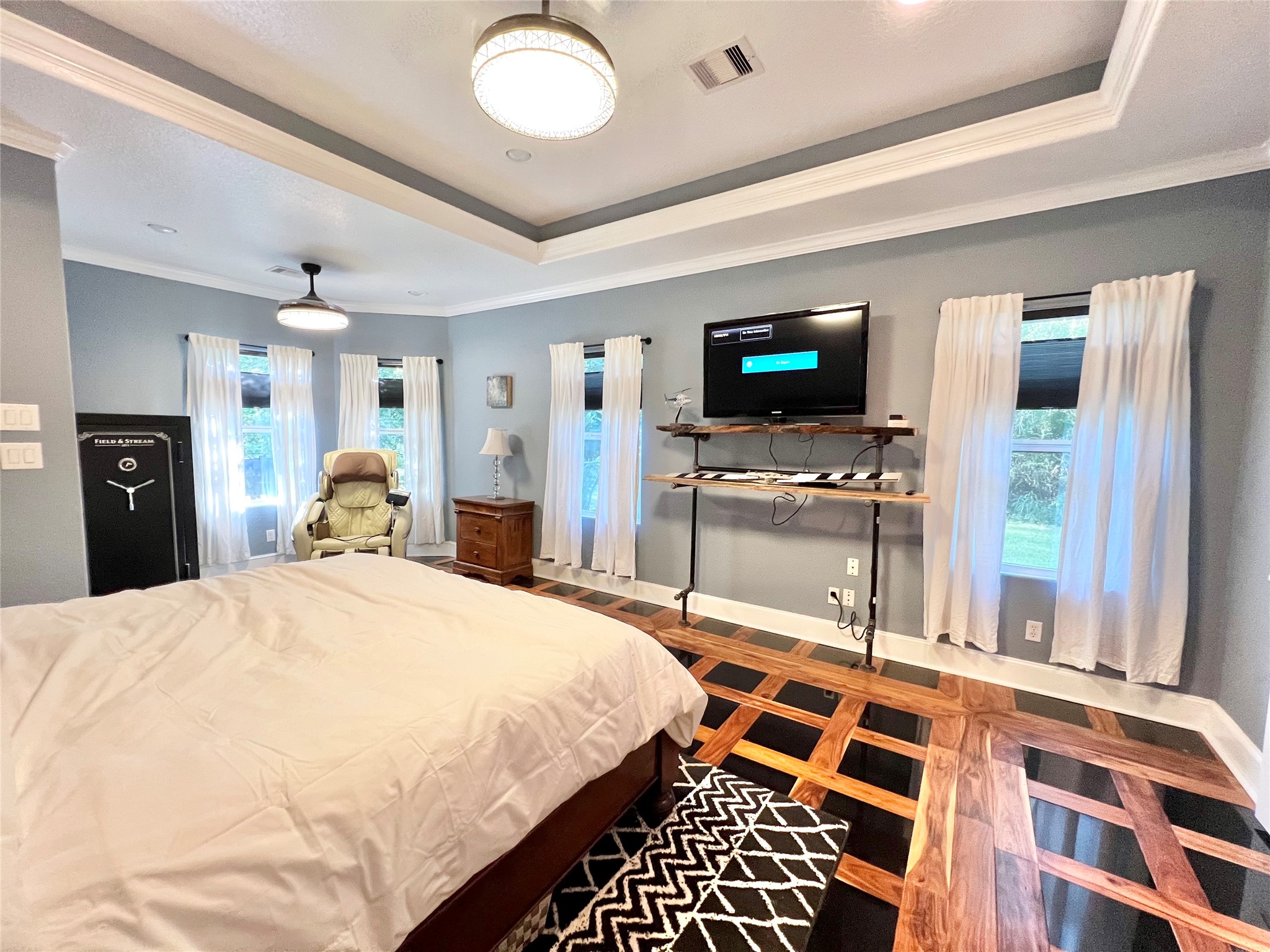 6714 Jay Road Hitchcock, TX 77563 - Photo 22 of 50 a bedroom with a bed and a flat screen tv