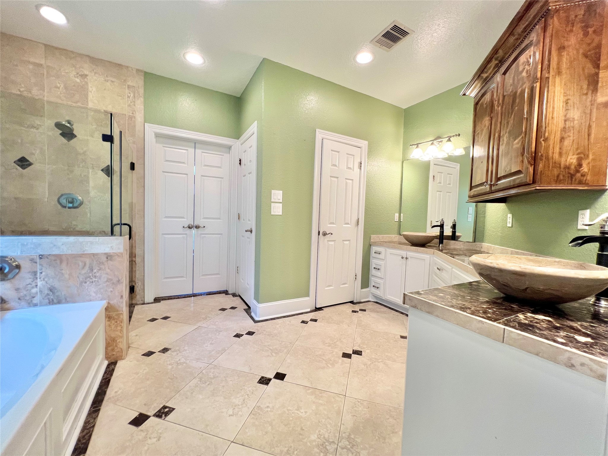 6714 Jay Road Hitchcock, TX 77563 - Photo 25 of 50 a bathroom with a tub sink and mirror