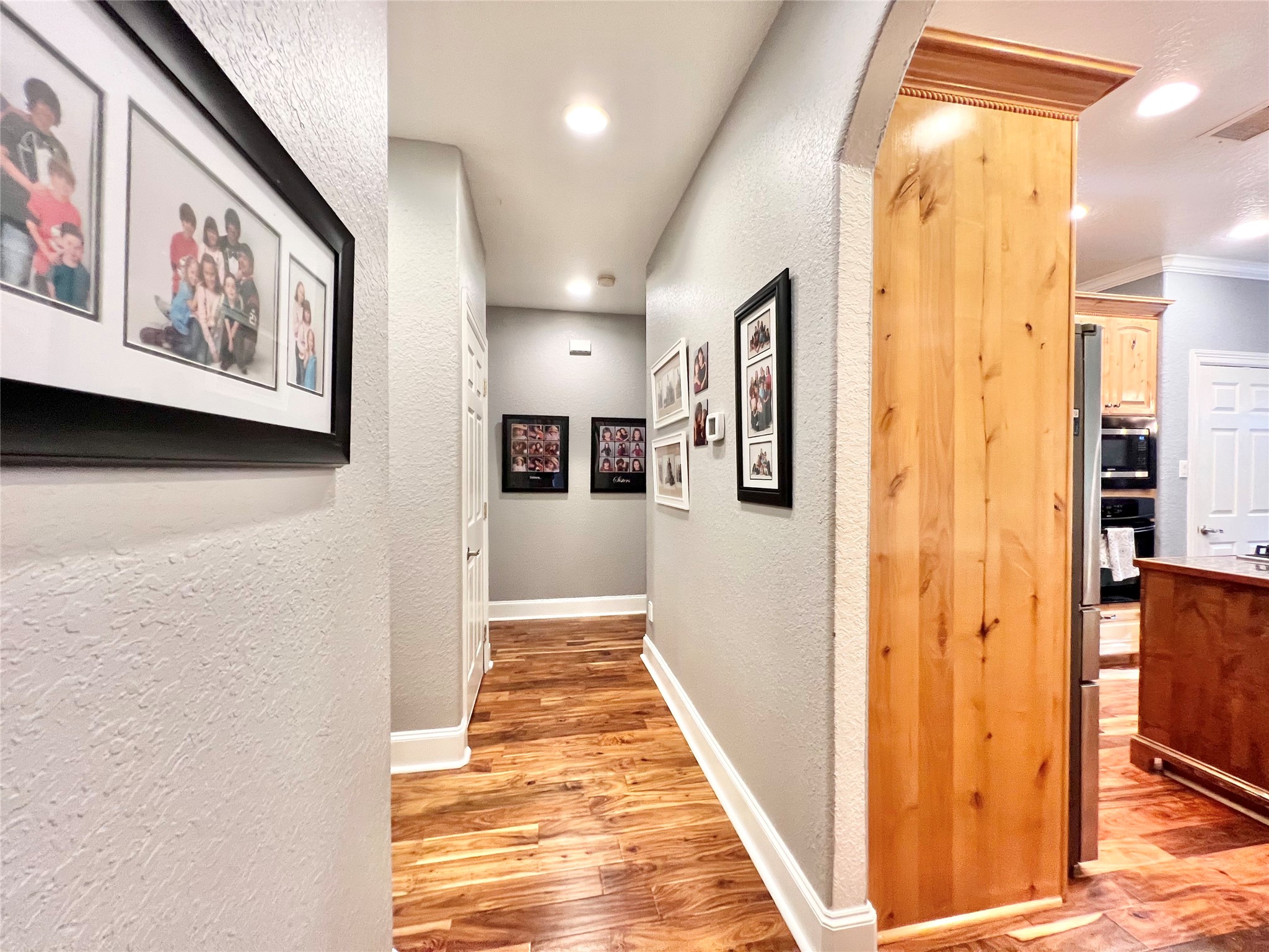 6714 Jay Road Hitchcock, TX 77563 - Photo 29 of 50 a view of a hallway with wooden floor and staircase