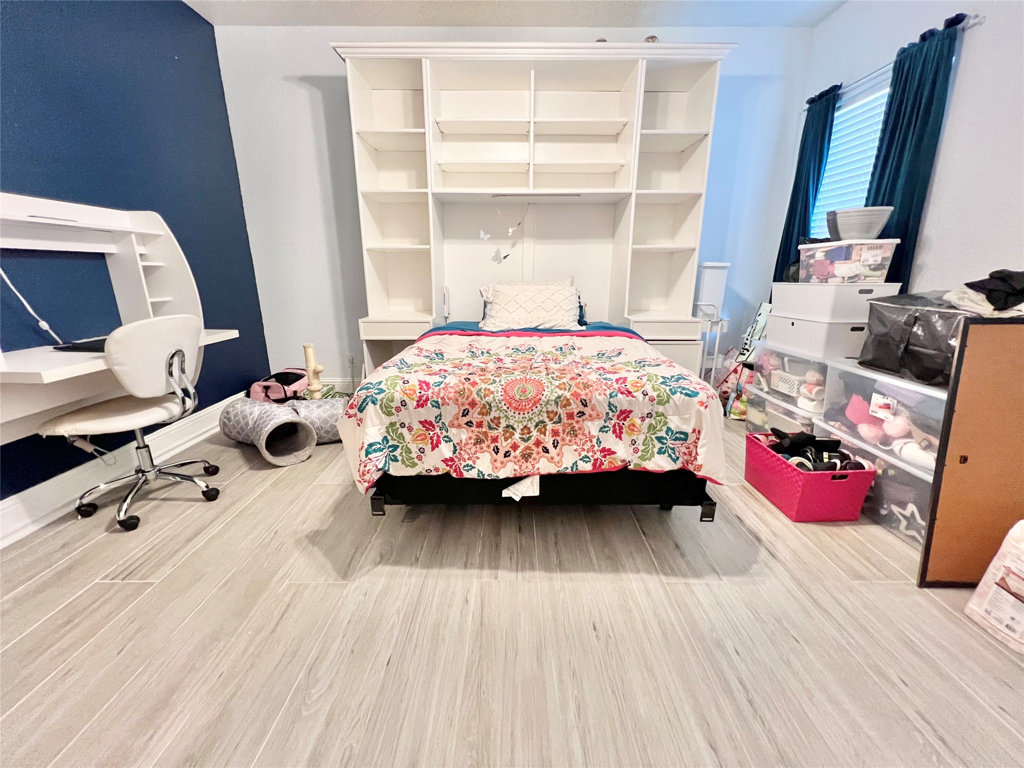 6714 Jay Road Hitchcock, TX 77563 - Photo 30 of 50 a bedroom with a bed and wooden floor