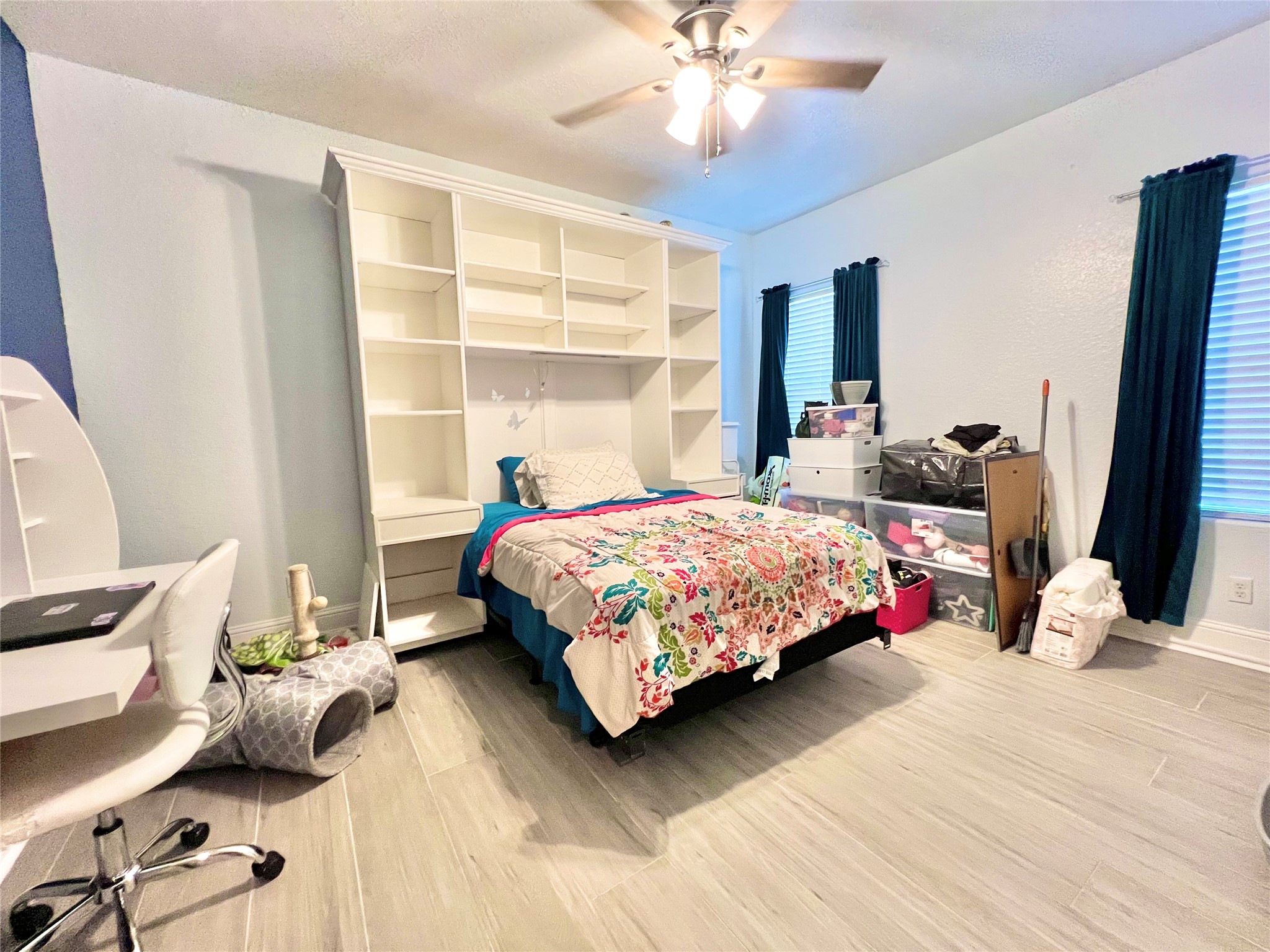 6714 Jay Road Hitchcock, TX 77563 - Photo 31 of 50 a bedroom with a bed couch and large window