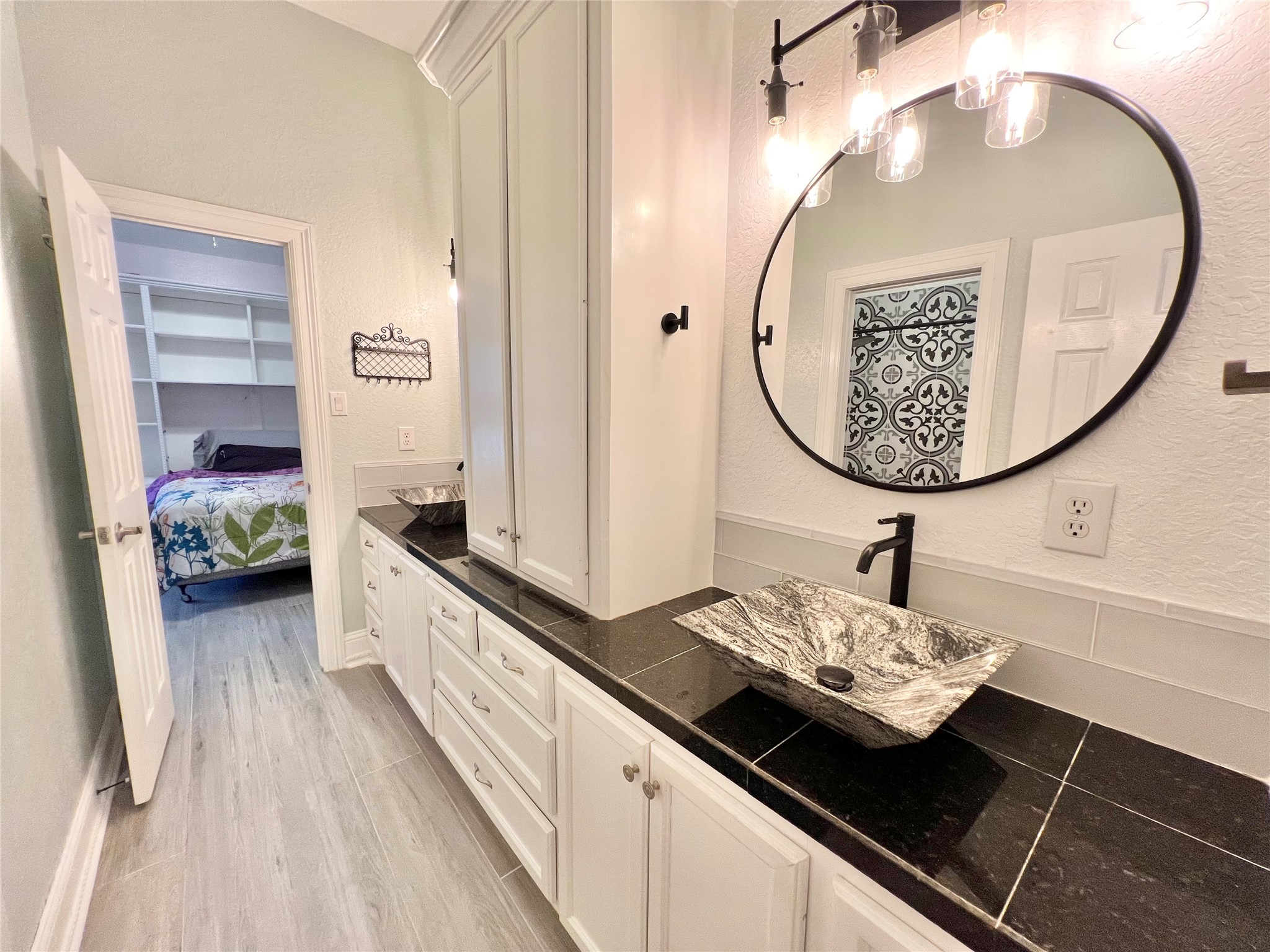 6714 Jay Road Hitchcock, TX 77563 - Photo 32 of 50 a bathroom with a sink and a mirror