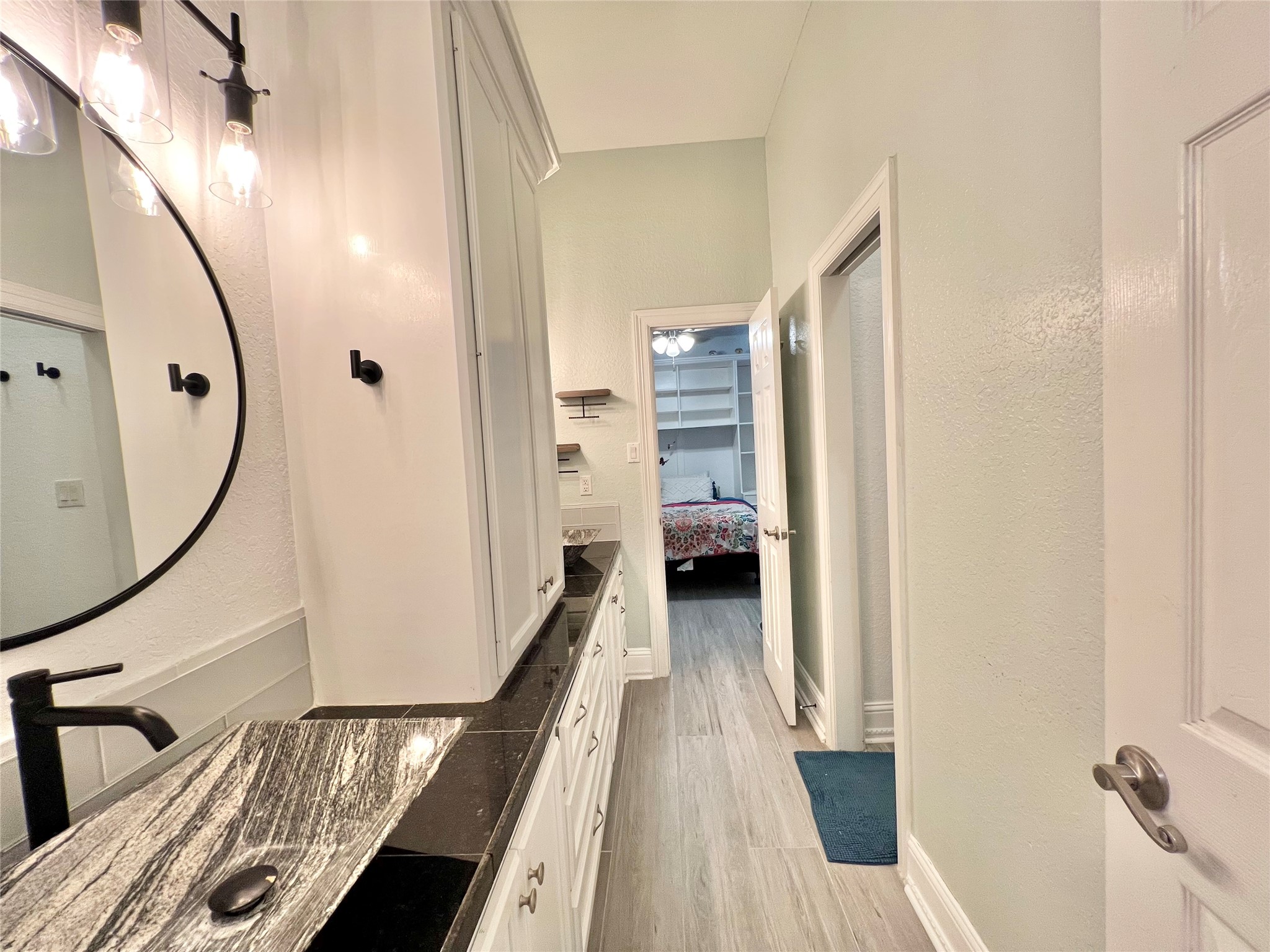 6714 Jay Road Hitchcock, TX 77563 - Photo 35 of 50 a view of a hallway with wooden floor and staircase