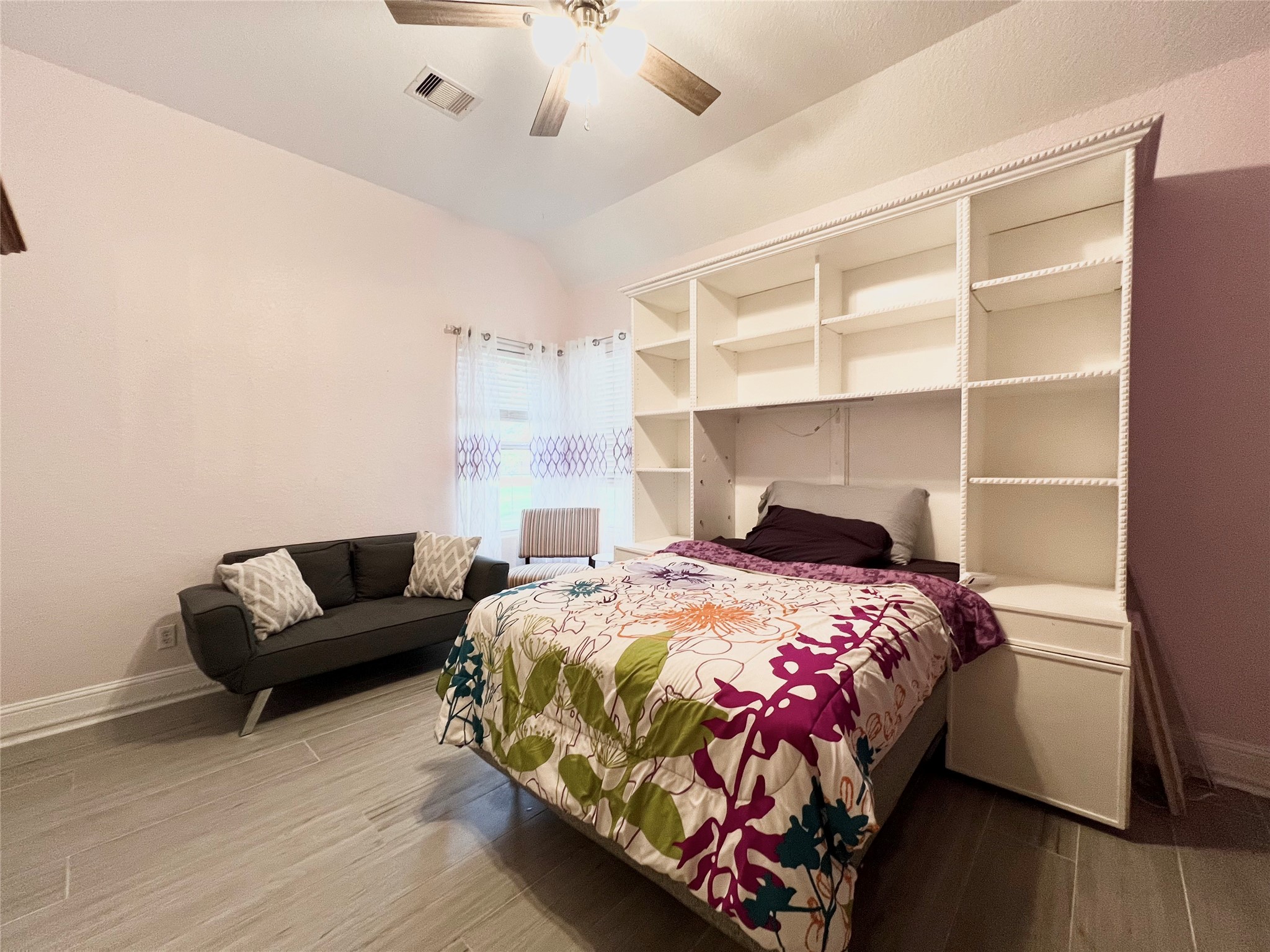 6714 Jay Road Hitchcock, TX 77563 - Photo 37 of 50 a bedroom with a bed furniture and wooden floor