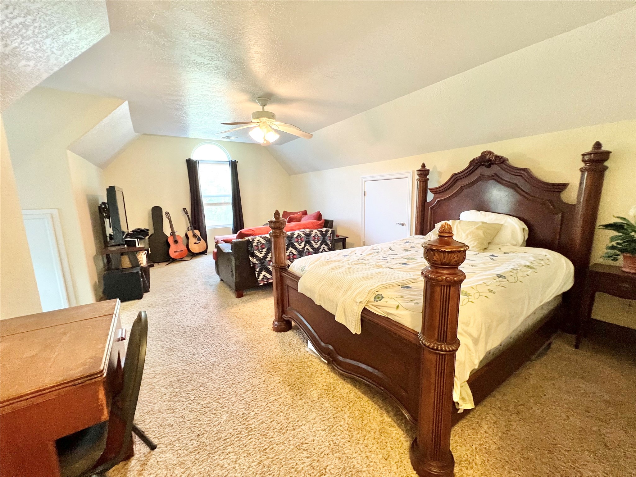 6714 Jay Road Hitchcock, TX 77563 - Photo 40 of 50 a bedroom with bed and a chandelier