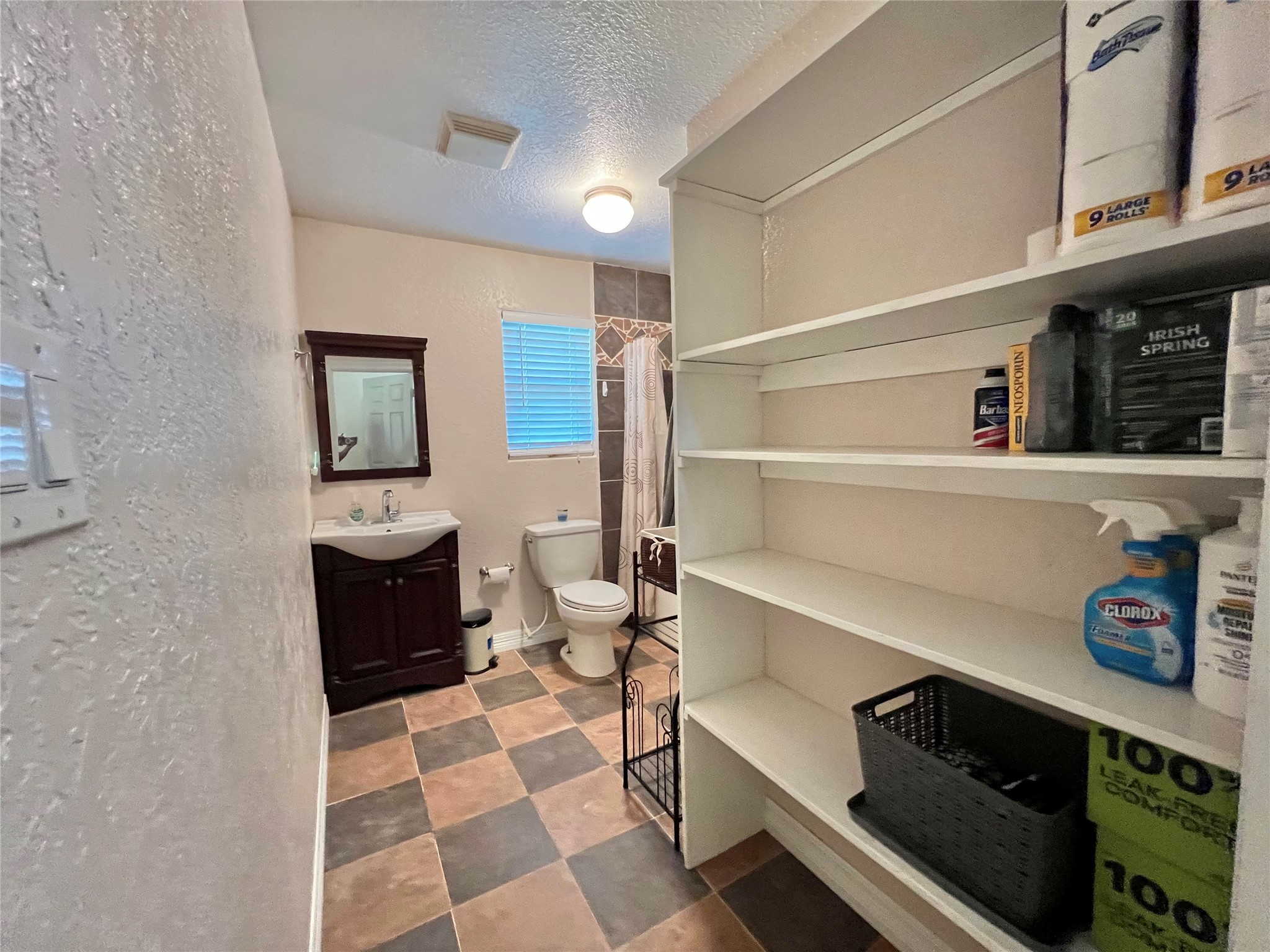 6714 Jay Road Hitchcock, TX 77563 - Photo 42 of 50 a bathroom with a sink toilet and shower