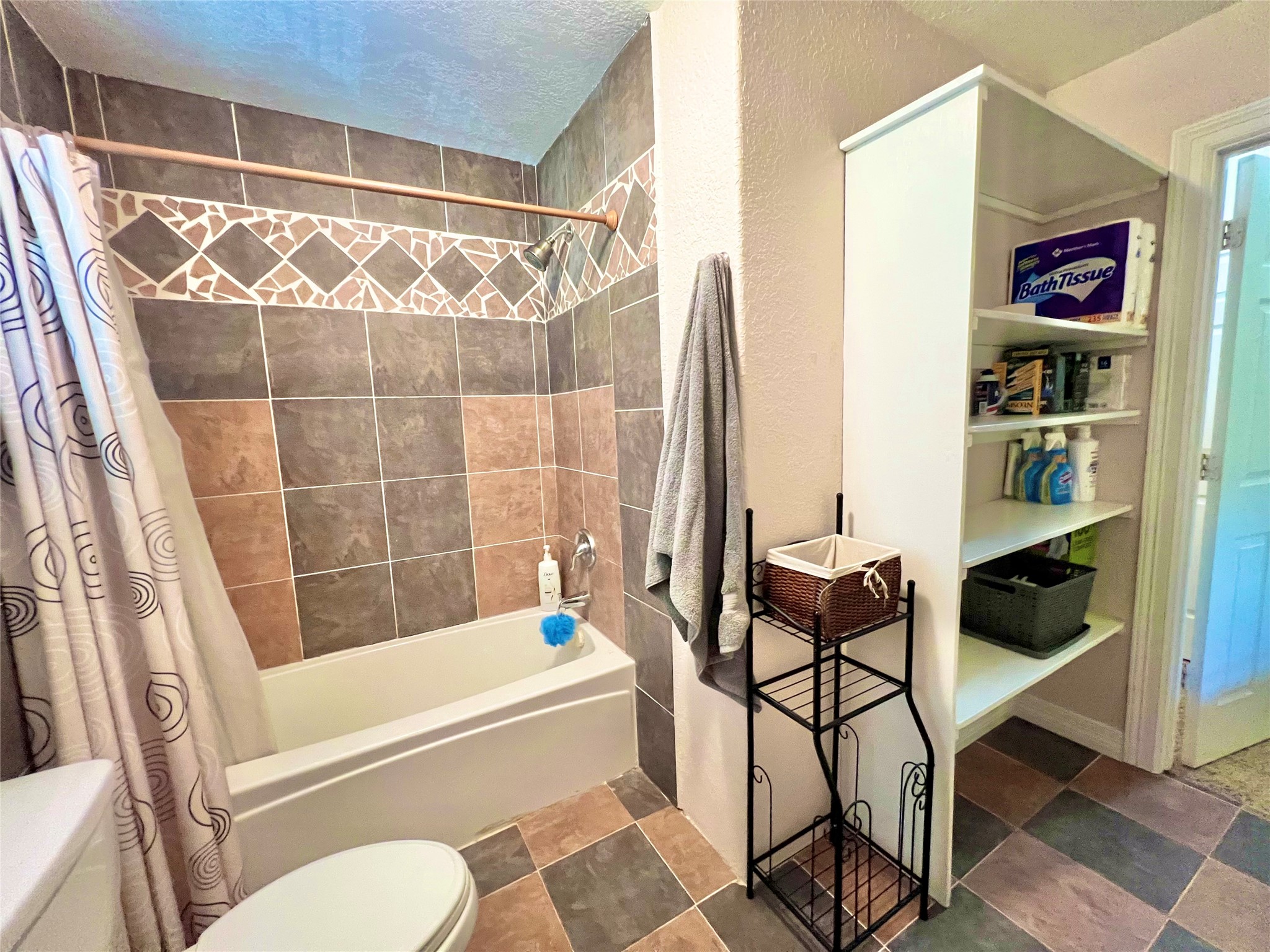 6714 Jay Road Hitchcock, TX 77563 - Photo 43 of 50 a bathroom with a bathtub and a shower