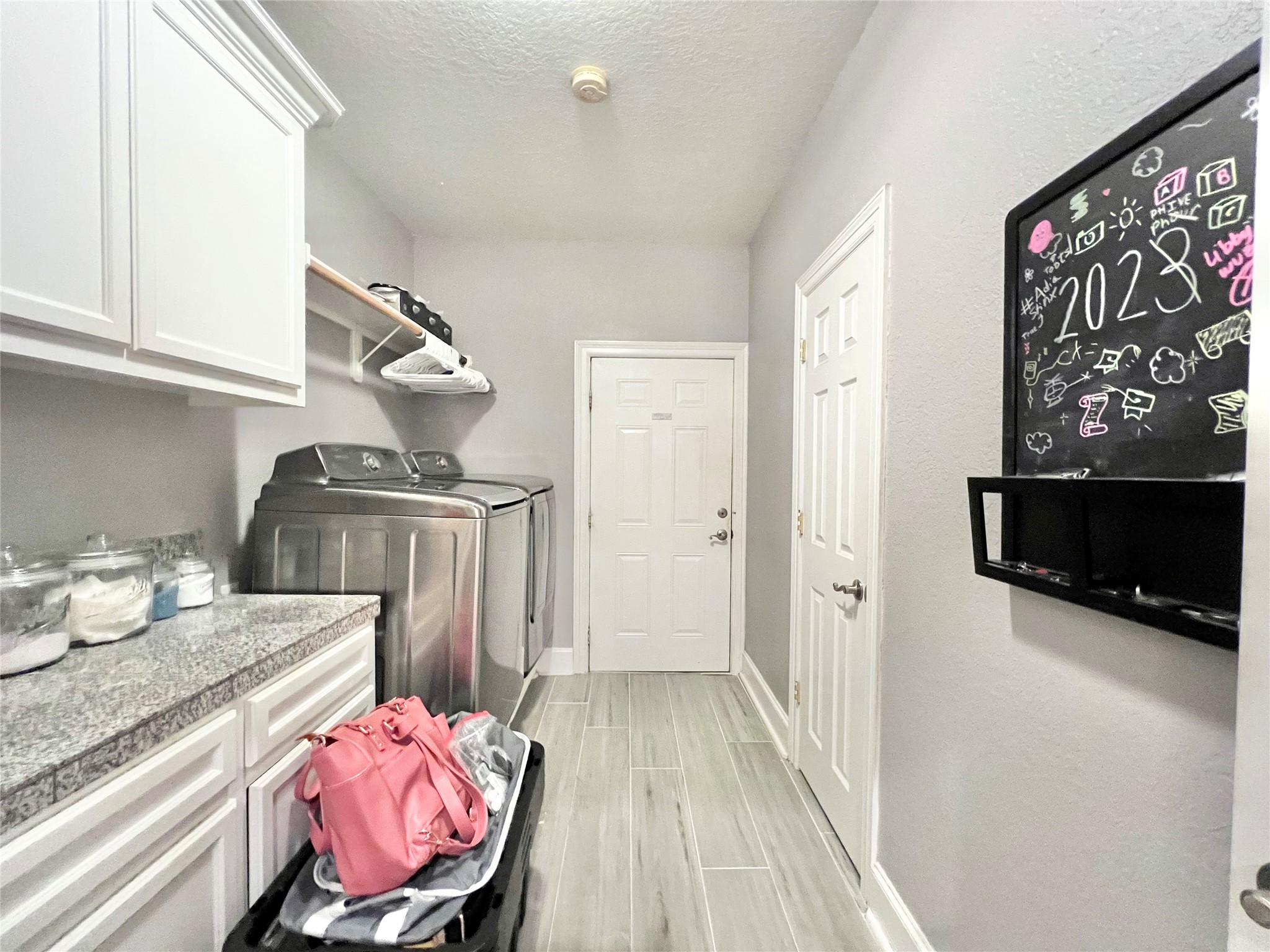6714 Jay Road Hitchcock, TX 77563 - Photo 45 of 50 a kitchen with granite countertop a stove and a sink