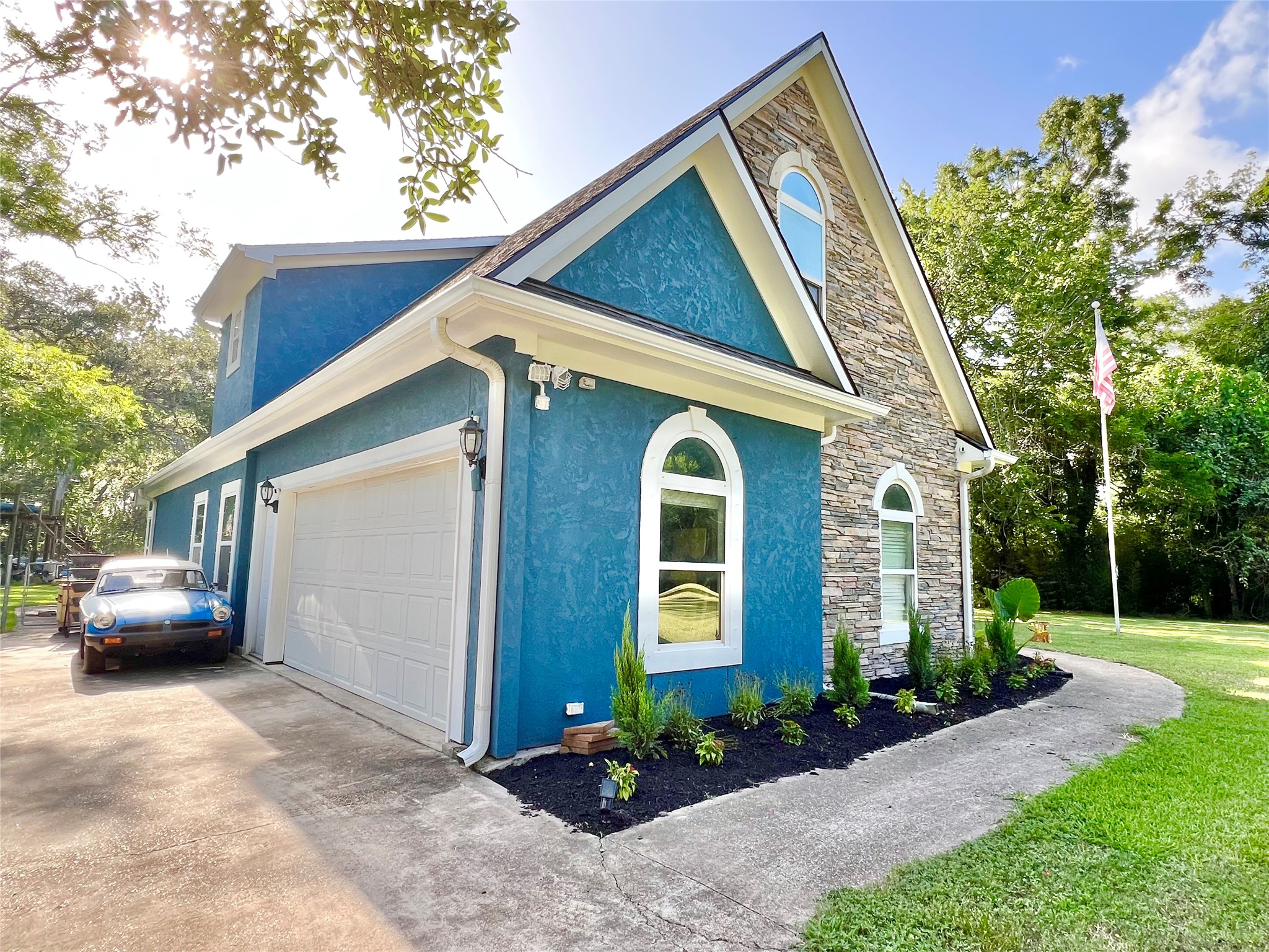 6714 Jay Road Hitchcock, TX 77563 - Photo 5 of 50 a front view of a house with a garden