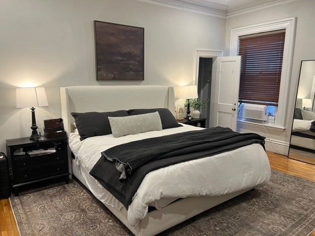 354 Marlborough Street, Unit 2 Boston, MA 02115 - Photo 5 of 10 a bedroom with a bed and wooden floor