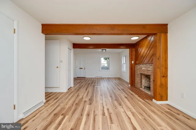 a view of room with wooden floor