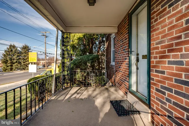 a view of a room with wooden floor and window