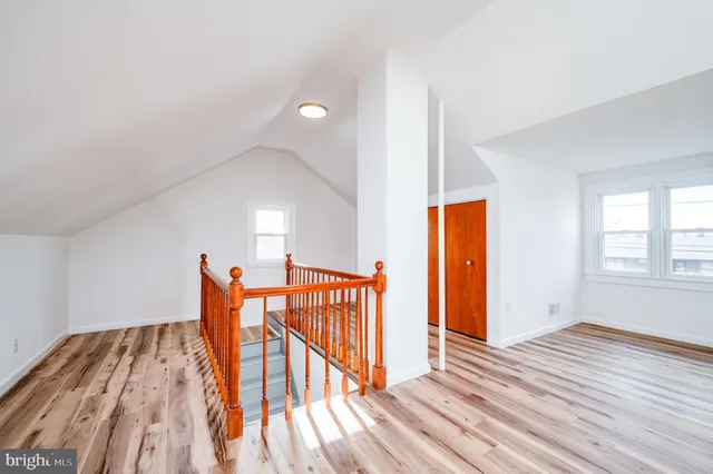 a view of an empty room with stairs