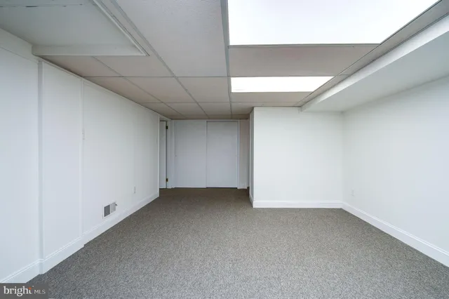 a bathroom with a sink a toilet and vanity