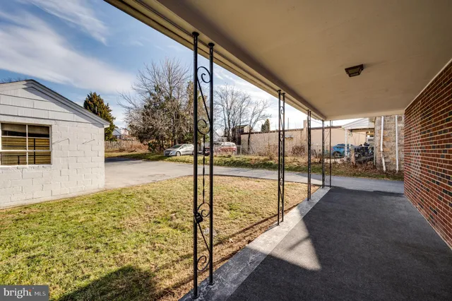 a view of a porch with wooden floor and stairs