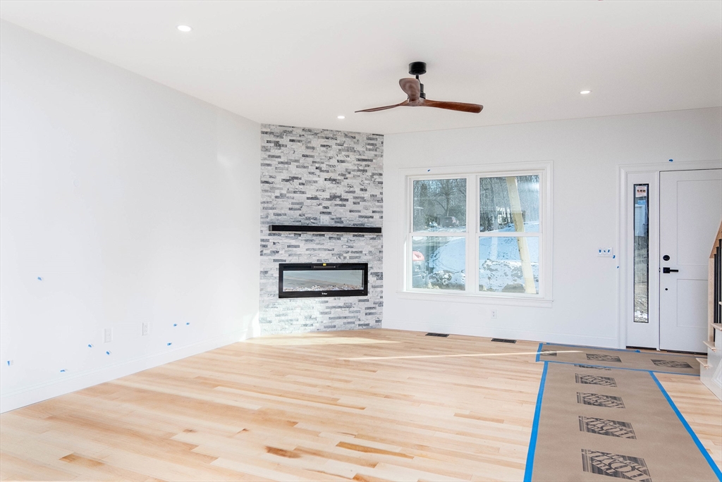 3 Crest Avenue Worcester, MA 01607 - Photo 12 of 34 a view of empty room with a fireplace and windows