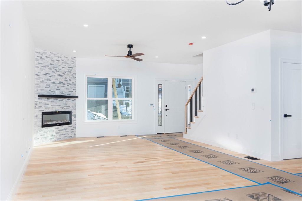 3 Crest Avenue Worcester, MA 01607 - Photo 13 of 34 a view of an empty room with wooden floor and a window