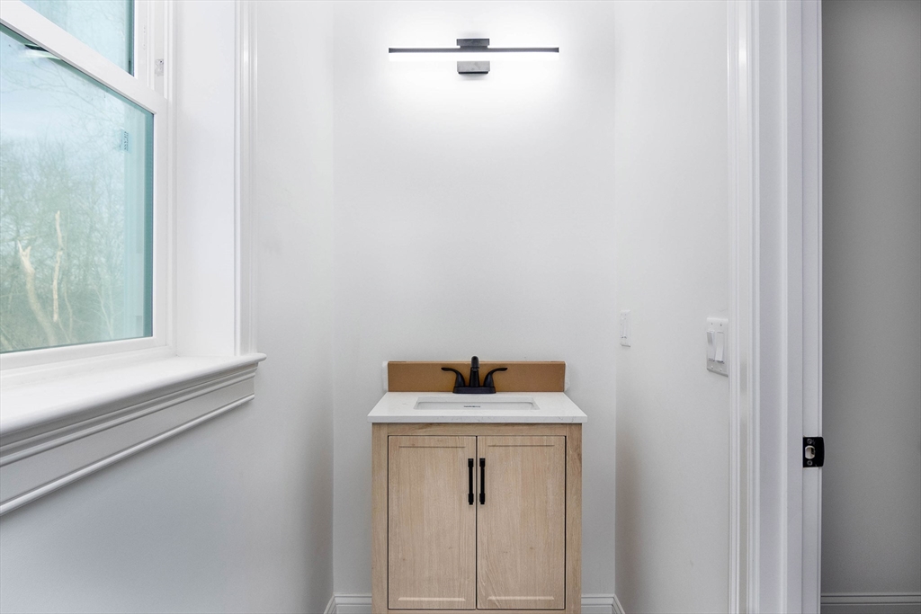 3 Crest Avenue Worcester, MA 01607 - Photo 16 of 34 a bathroom with a sink and mirror