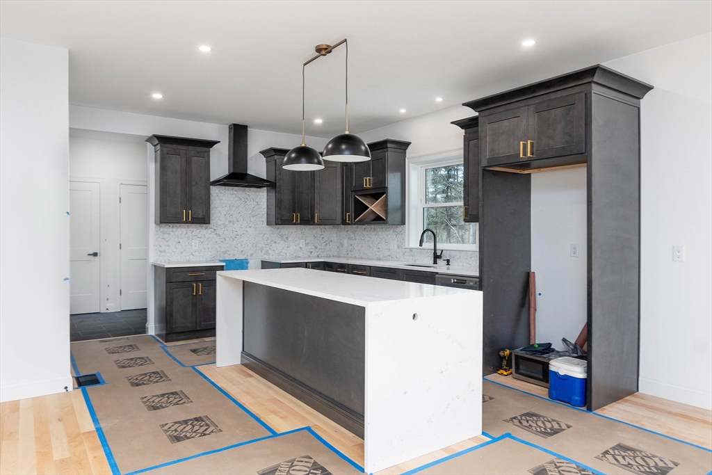 3 Crest Avenue Worcester, MA 01607 - Photo 2 of 34 a kitchen with stainless steel appliances kitchen island granite countertop a sink stove and refrigerator
