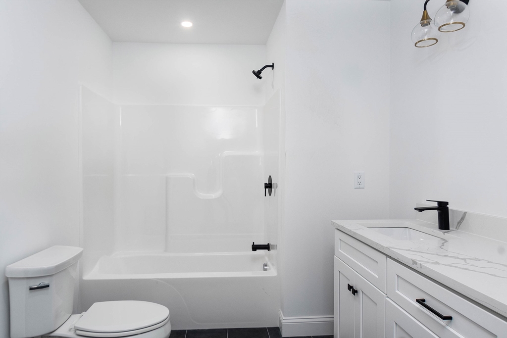 3 Crest Avenue Worcester, MA 01607 - Photo 21 of 34 a bathroom with a sink a toilet and shower