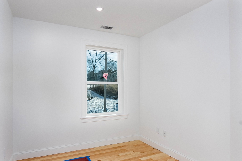 3 Crest Avenue Worcester, MA 01607 - Photo 23 of 34 a view of a small space with wooden floor and a window