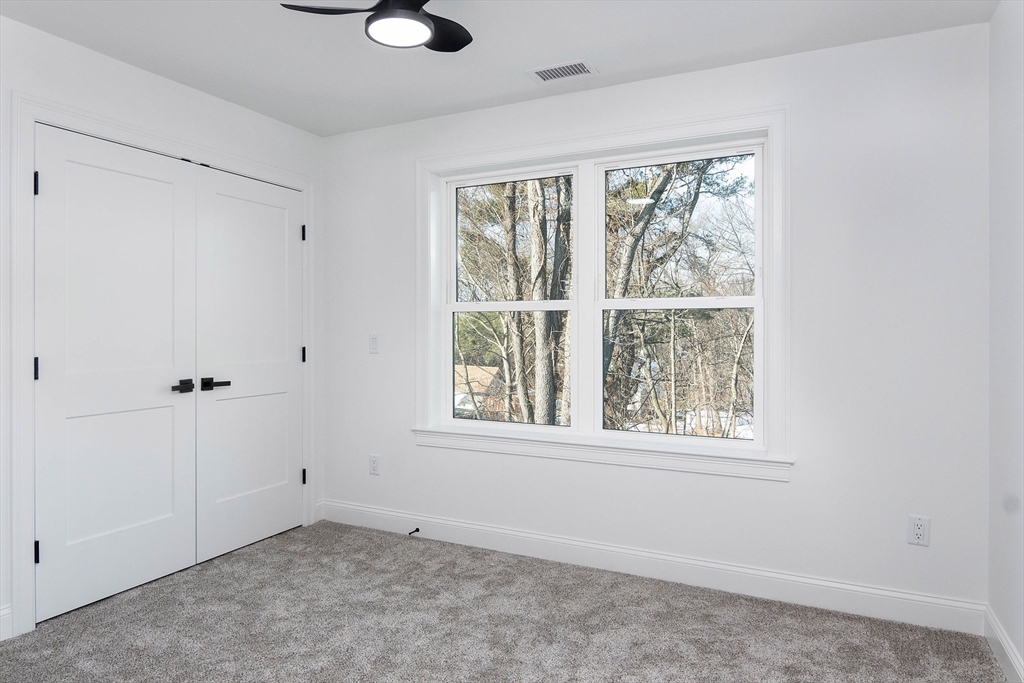3 Crest Avenue Worcester, MA 01607 - Photo 24 of 34 wooden floor in an empty room with a window