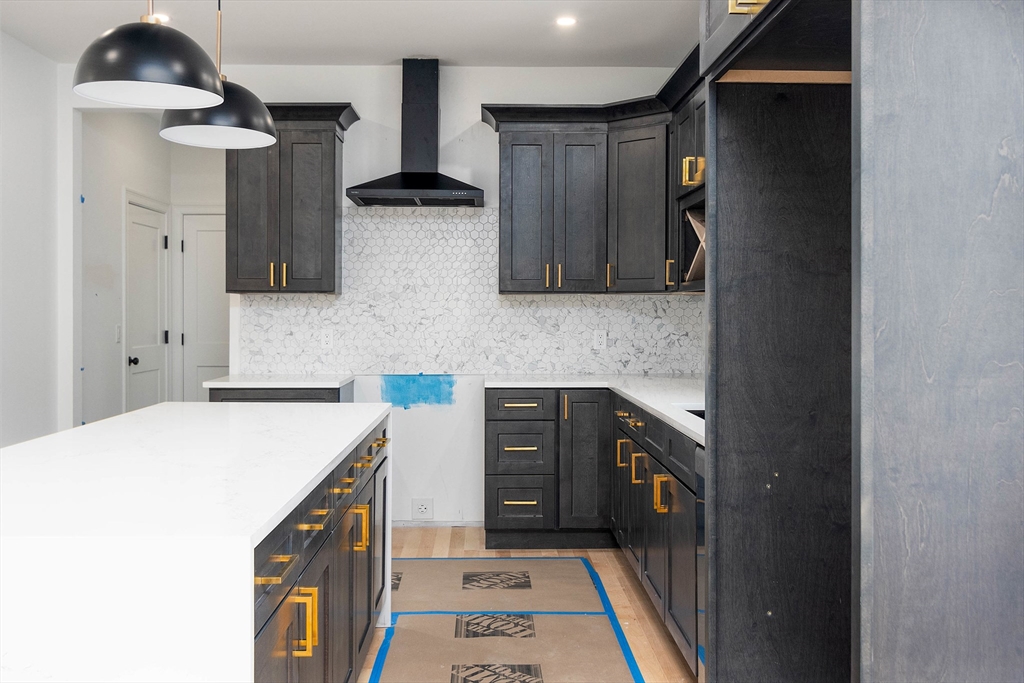 3 Crest Avenue Worcester, MA 01607 - Photo 6 of 34 a kitchen with a sink and a refrigerator