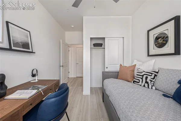 a bedroom with a bed and a couch