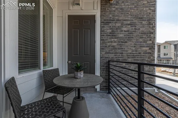 a view of a balcony and table and chairs