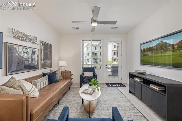 a living room with furniture and a large window
