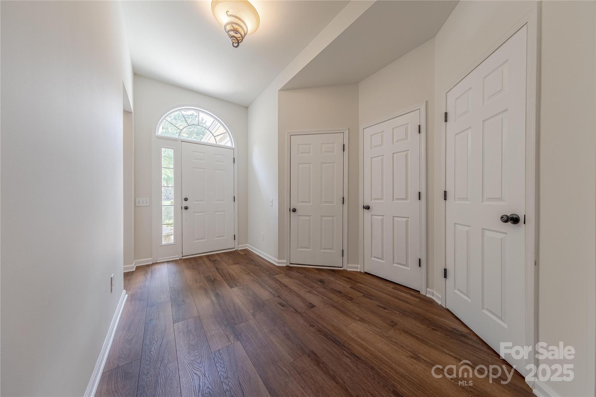 901 Clearbrook Road Matthews, NC 28105 - Photo 2 of 37 a view of a livingroom with wooden floor and a window