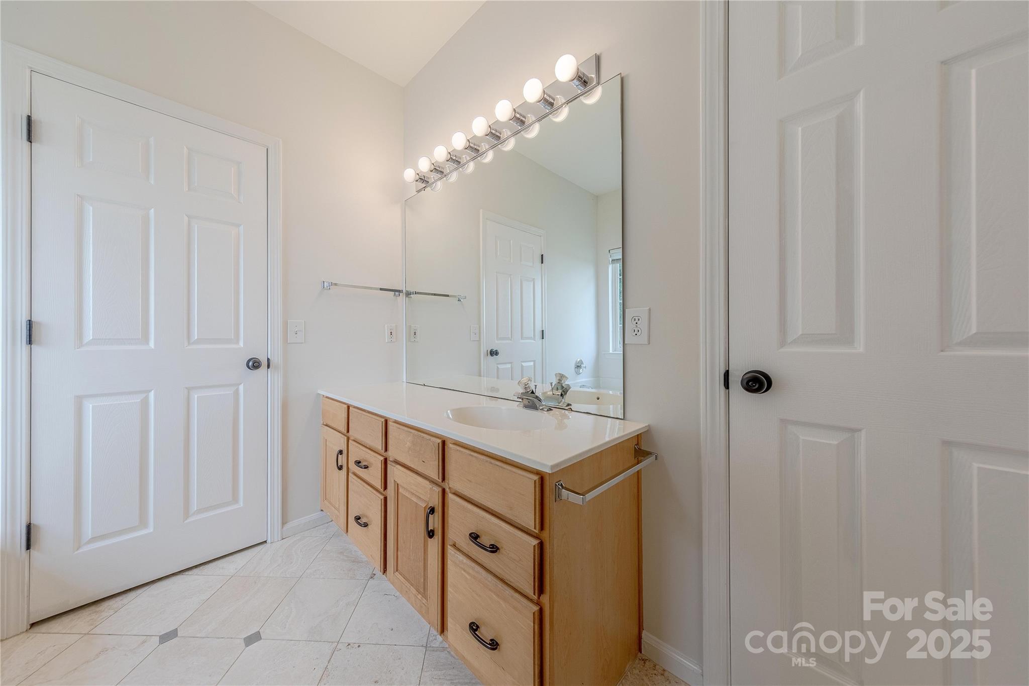 901 Clearbrook Road Matthews, NC 28105 - Photo 21 of 37 a spacious bathroom with a double vanity sink a mirror and a shower