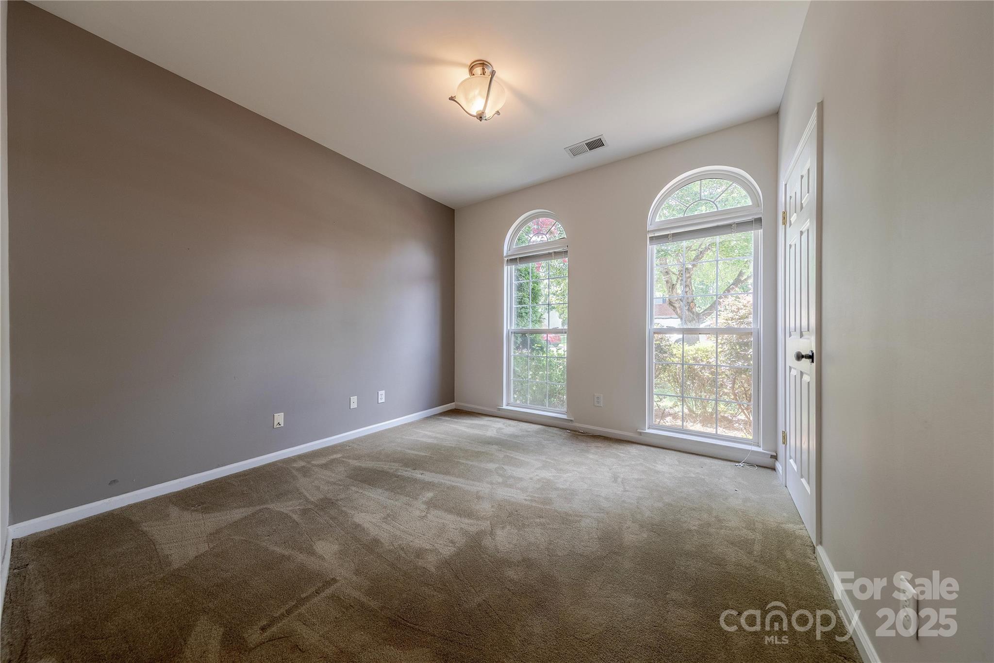 901 Clearbrook Road Matthews, NC 28105 - Photo 22 of 37 an empty room with windows and closet