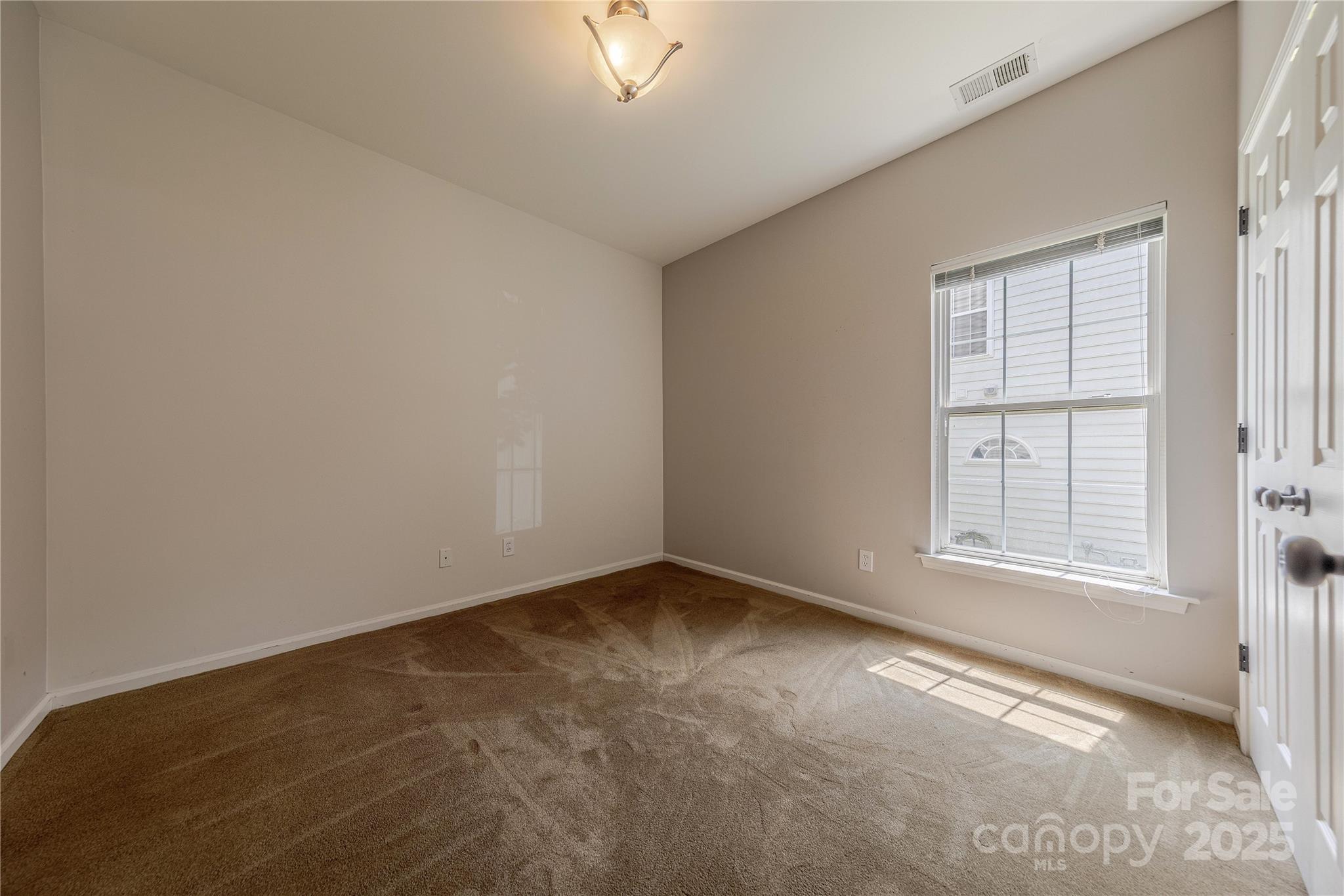 901 Clearbrook Road Matthews, NC 28105 - Photo 24 of 37 an empty room with a window
