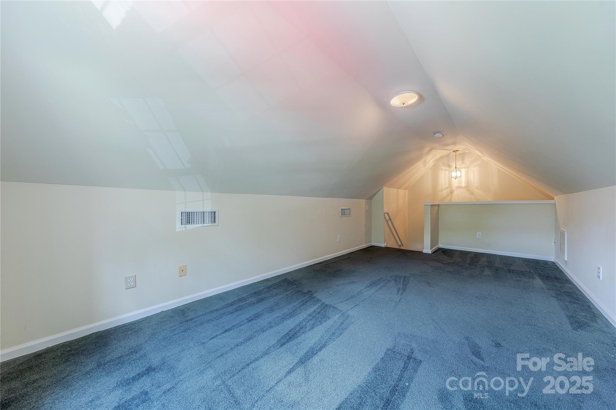 901 Clearbrook Road Matthews, NC 28105 - Photo 29 of 37 an empty room with wooden floor and windows