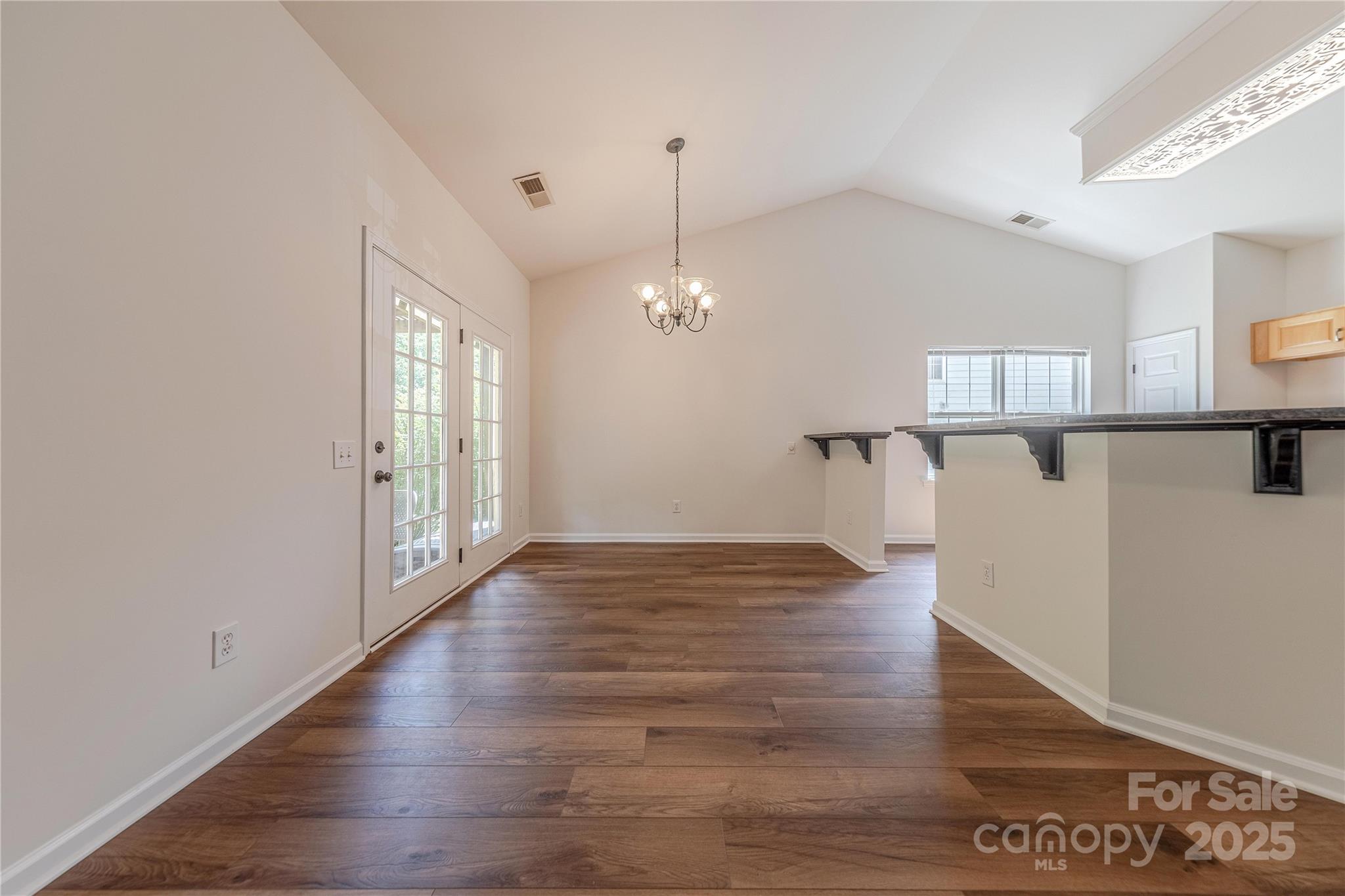 901 Clearbrook Road Matthews, NC 28105 - Photo 8 of 37 a view of empty room with wooden floor and fan