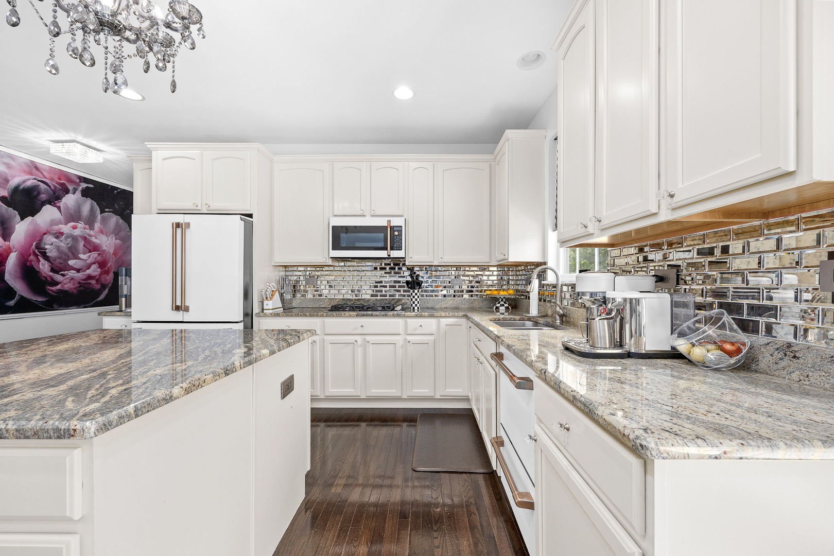2297 Deerpath Road Bolingbrook, IL 60490 - Photo 16 of 46 a kitchen with stainless steel appliances granite countertop a sink a stove and cabinets