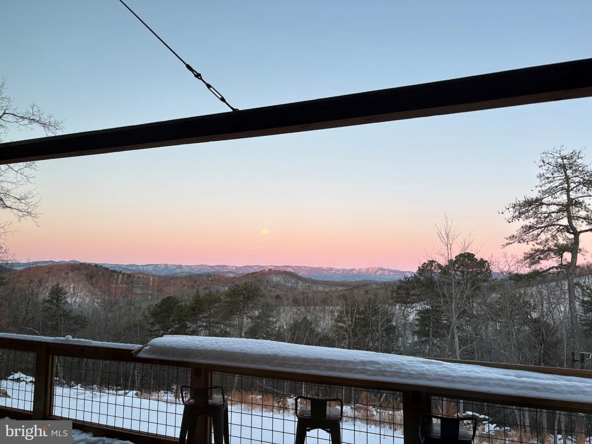 415 Grahams Farm Road Stuart, VA 24171 - Photo 116 of 121 Serene sunset over snowy mountains.