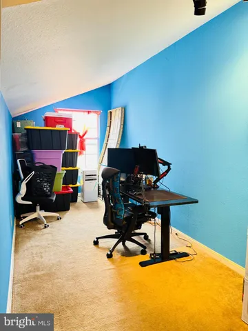 a room with furniture and air hockey table
