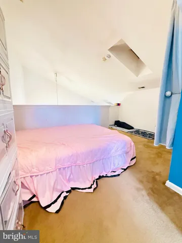 a bedroom with a bed and a cabinets