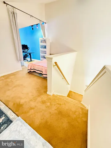 a view of a swimming pool with a sink and wooden floor
