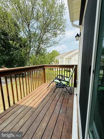 a view of balcony with wooden floor