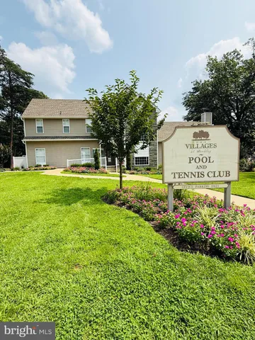 a sign on the side of the house