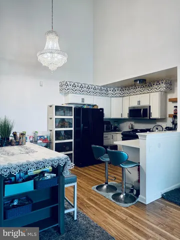 a living room with kitchen furniture and a kitchen view