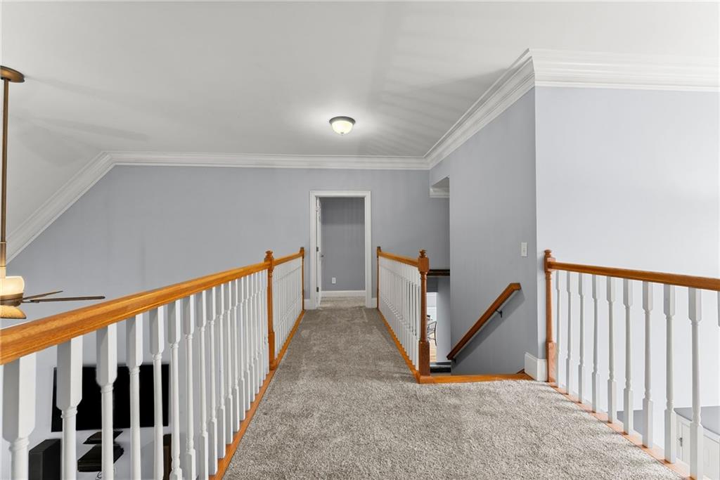 6643 Windvane Point Clermont, GA 30527 - Photo 39 of 88 a view of a hallway with staircase