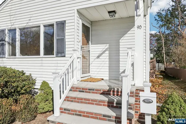 a view of a balcony with potted plants